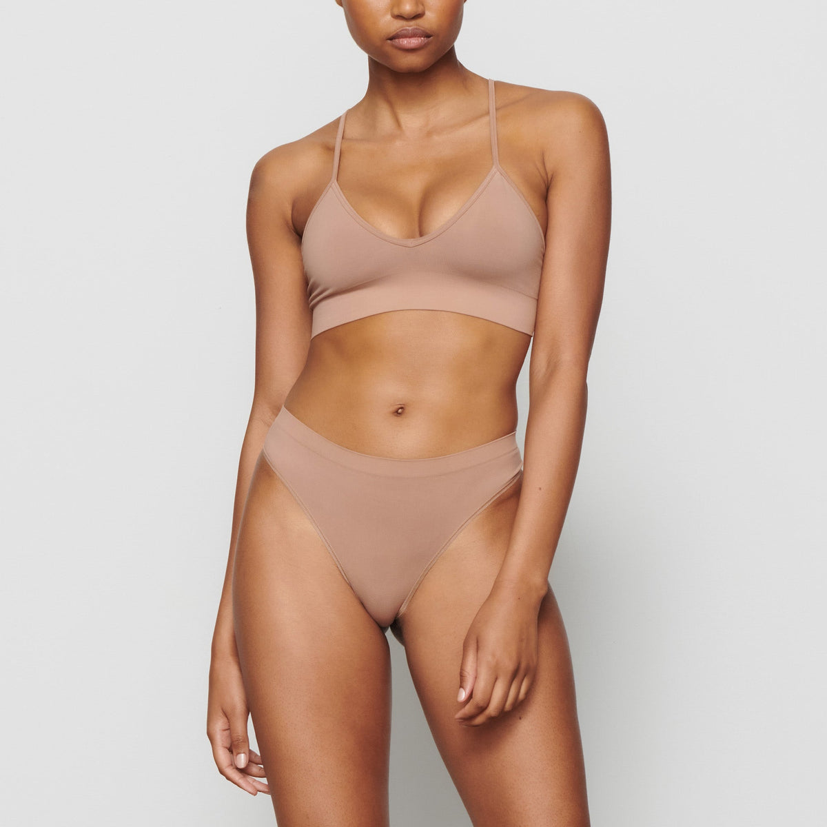 SOFT SMOOTHING THONG WORN BY A MODEL IN FRONT VIEW