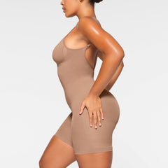 SEAMLESS SCULPT LOW BACK MID THIGH BODYSUIT ON A MODEL BACK VIEW