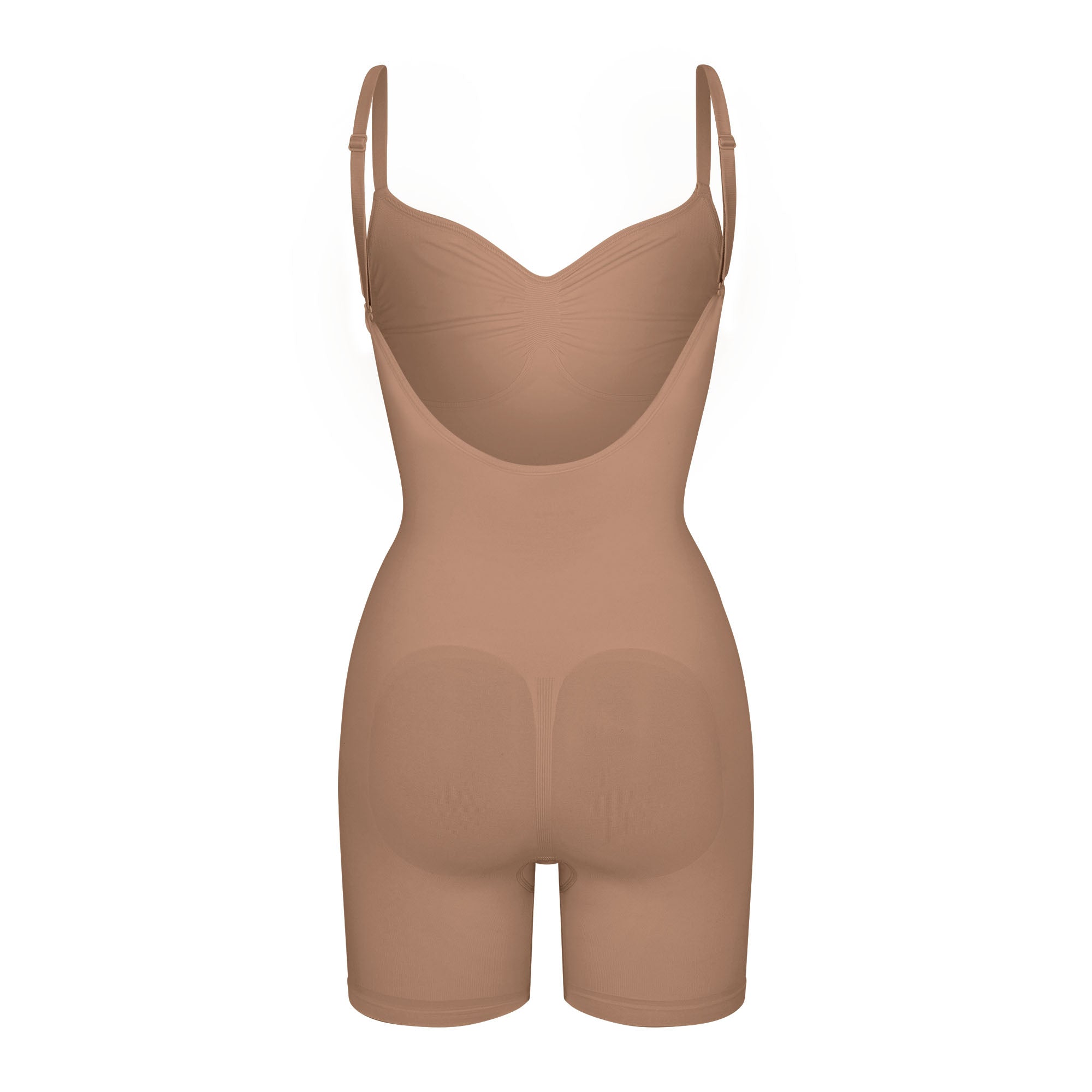 SEAMLESS SCULPT LOW BACK MID THIGH BODYSUIT LAYS FLAT ON A WHITE BACKGROUND | FLT