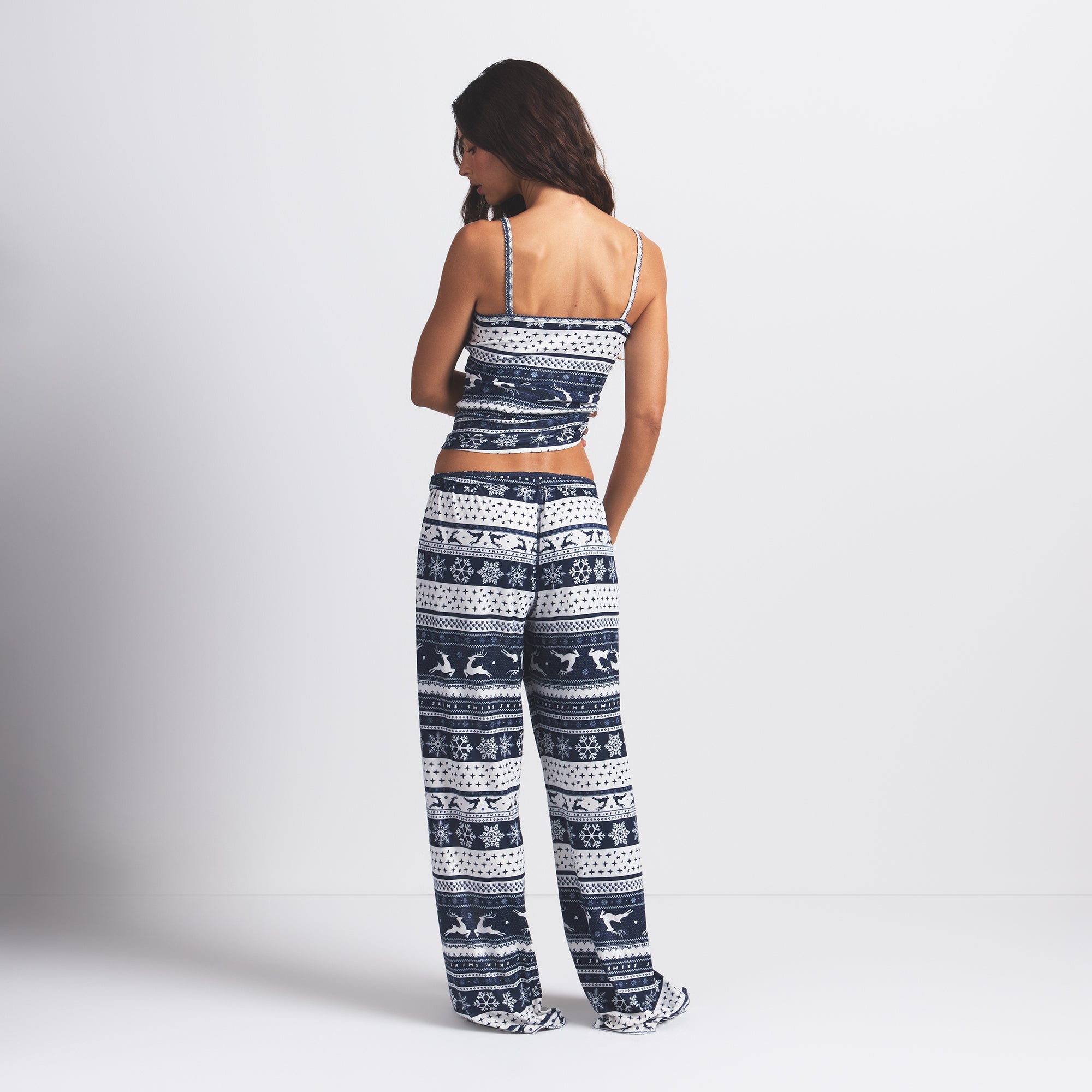 LOGO PLUSH POINTELLE CAMI | NAVY DEER FAIR ISLE ON A MODEL BACK VIEW @ | FOCUS: 0.0, 1.0, 0.9