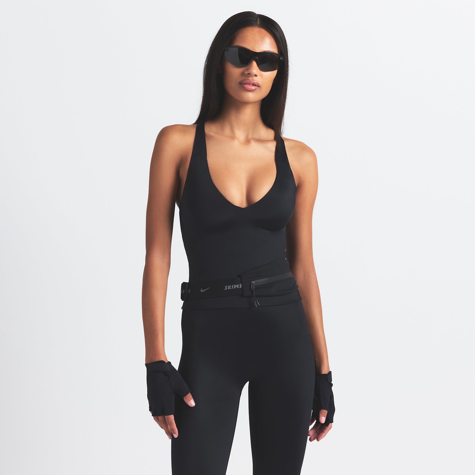 NikeSKIMS SHINE V-NECK TANK | OBSIDIAN ON A MODEL SIDE VIEW