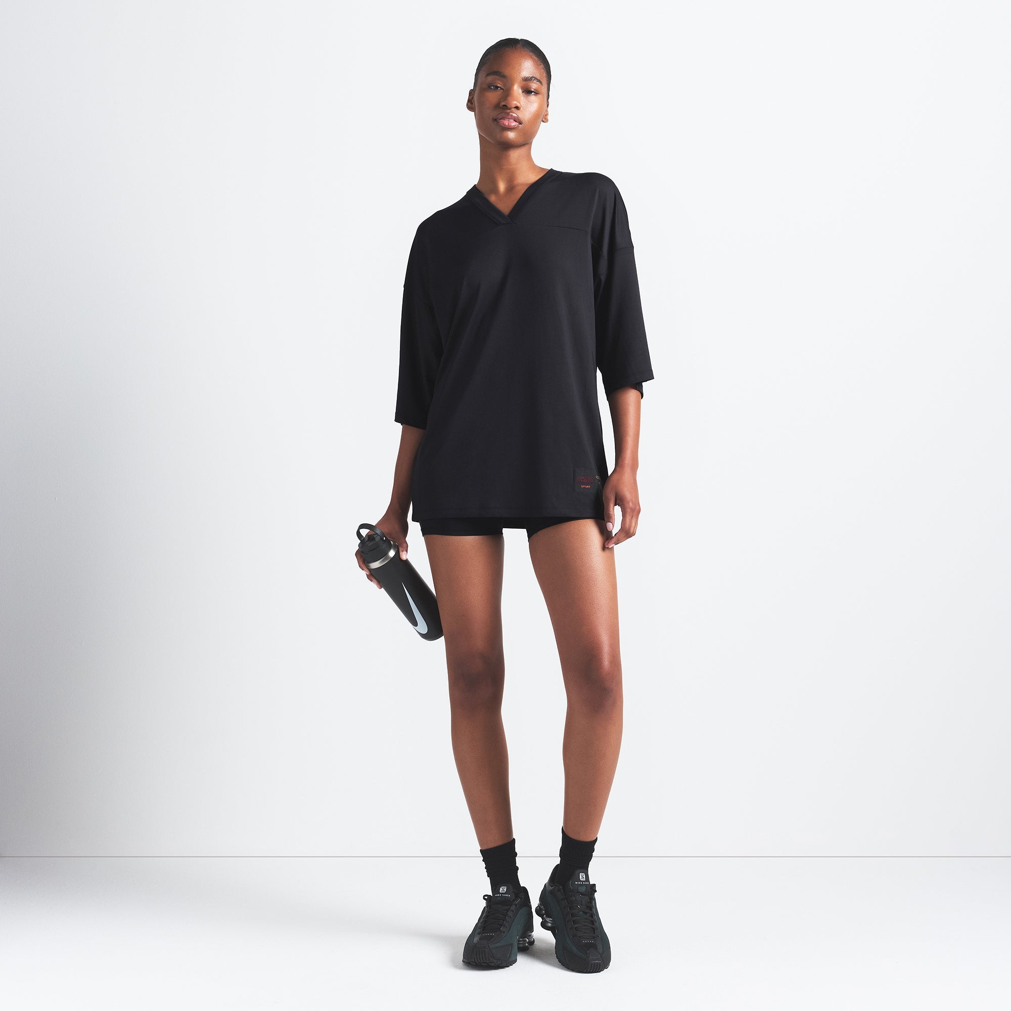 NikeSKIMS AIRY V-NECK OVERSIZED TOP | OBSIDIAN ON A MODEL FRONT VIEW @ | FOCUS: 0.9, 0.1, 0.7