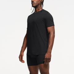 SKIMS BASICS MENS LIGHTWEIGHT T-SHIRT 3-PACK | OBSIDIAN ON A MODEL SIDE VIEW