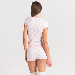 LOGO POINTELLE BABY TEE AND SHORT SET | SNOW LACE HEARTS ON A MODEL SIDE VIEW @ | FOCUS: 0.0, 1.0, 0.9