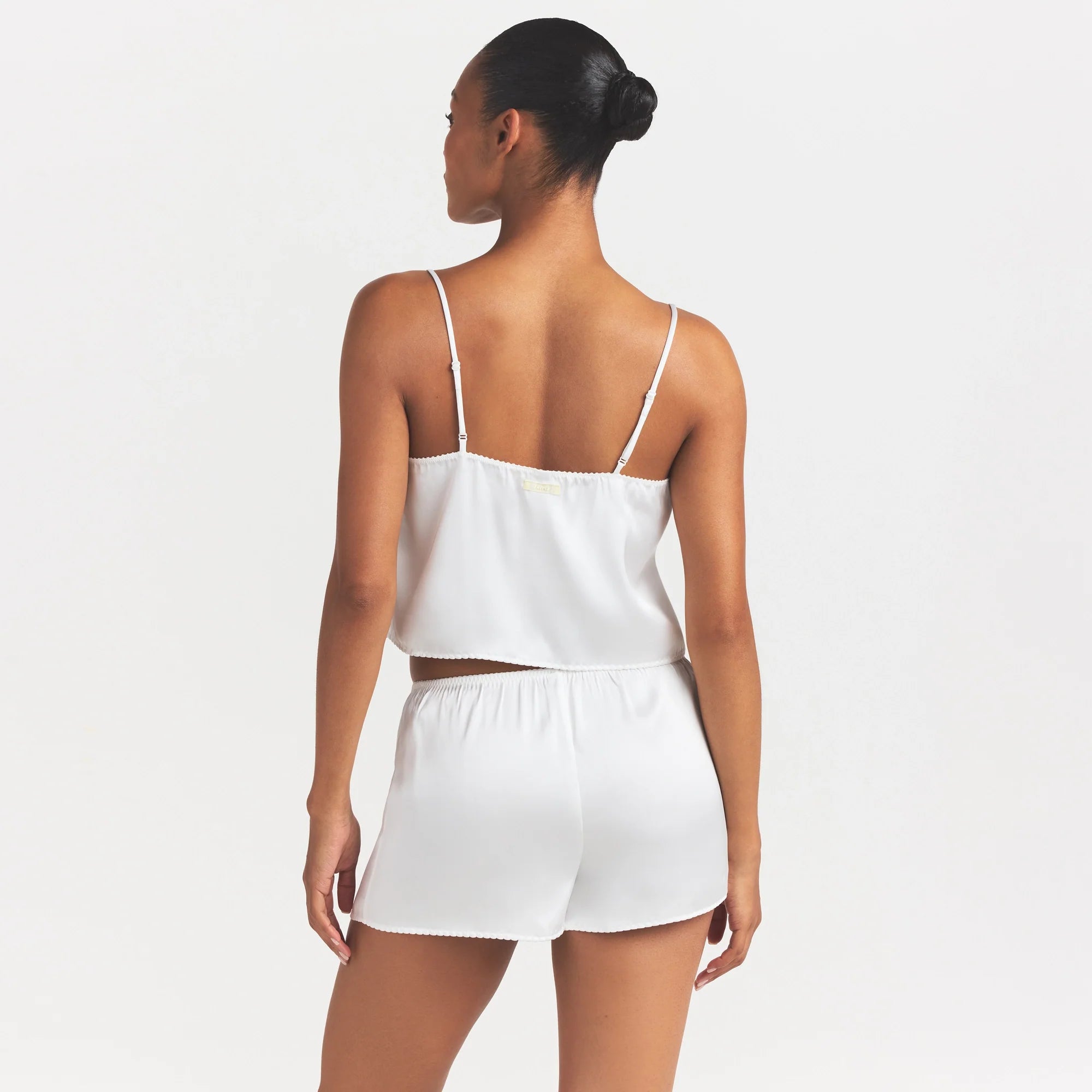 WOVEN SHINE CAMI AND SHORT SLEEP SET | IVORY ON A MODEL SIDE VIEW @ | FOCUS: 0.0, 1.0, 0.9