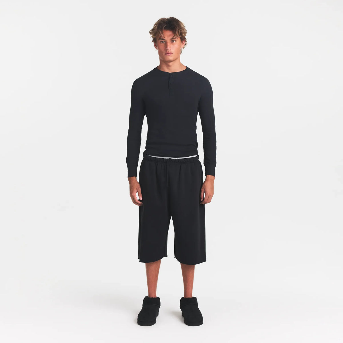 SKIMS COTTON RIB MENS HENLEY | ONYX ON A MODEL FRONT VIEW @ | FOCUS: 0.0, 1.0, 0.9