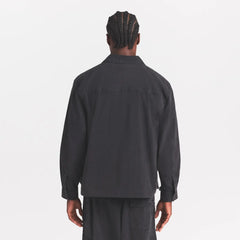 WOVEN MENS RELAXED SHIRT | ONYX ON A MODEL SIDE VIEW @ | FOCUS: 0.0, 1.0, 0.9