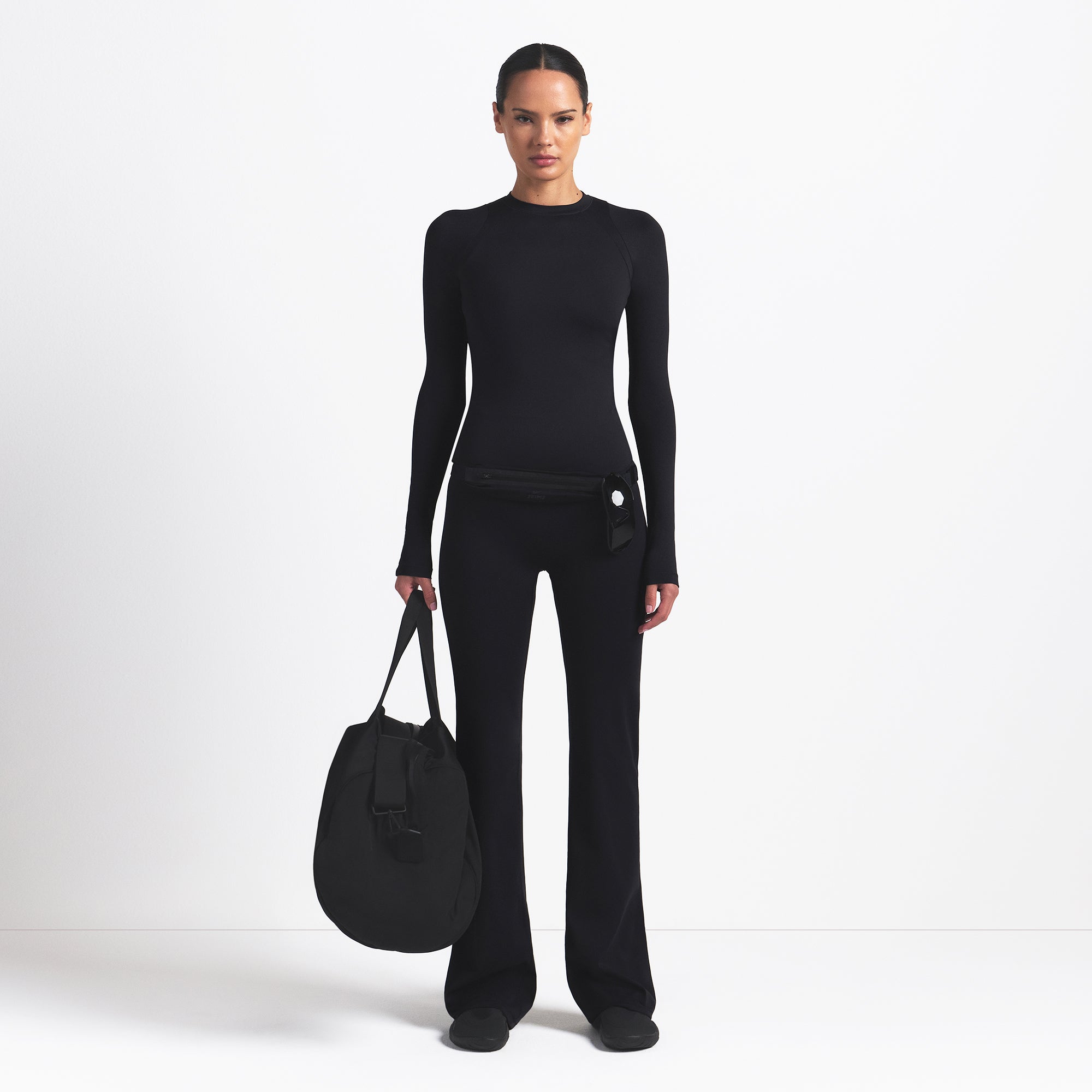 NikeSKIMS AIRY LONG SLEEVE CREW NECK TOP | OBSIDIAN ON A MODEL FRONT VIEW @ | FOCUS: 0.9, 0.1, 0.7