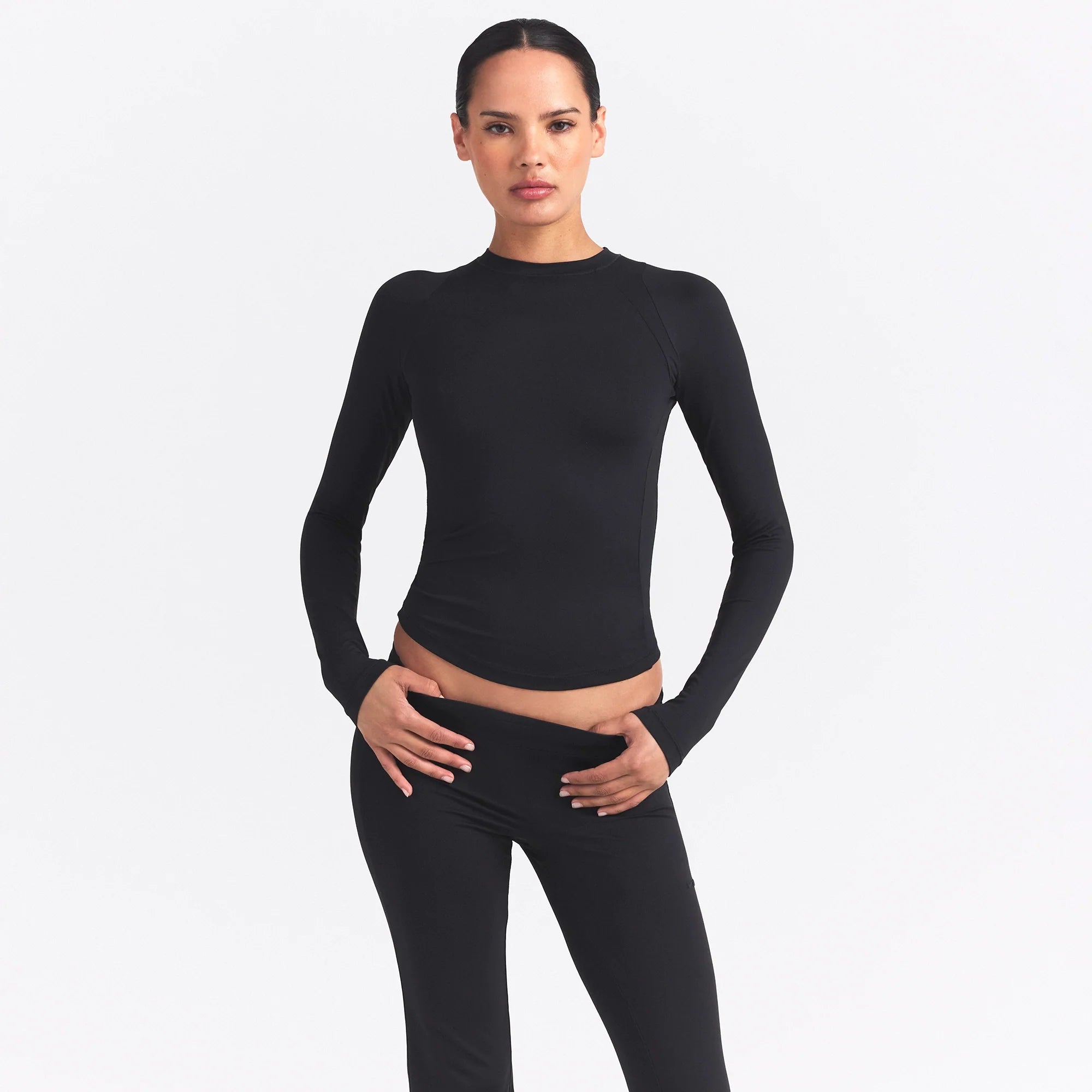 NikeSKIMS AIRY LONG SLEEVE CREW NECK TOP | OBSIDIAN ON A MODEL SIDE VIEW @ | FOCUS: 0.9, 0.1, 0.7