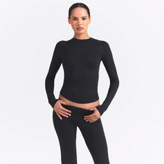 NikeSKIMS AIRY LONG SLEEVE CREW NECK TOP | OBSIDIAN ON A MODEL SIDE VIEW @ | FOCUS: 0.9, 0.1, 0.7