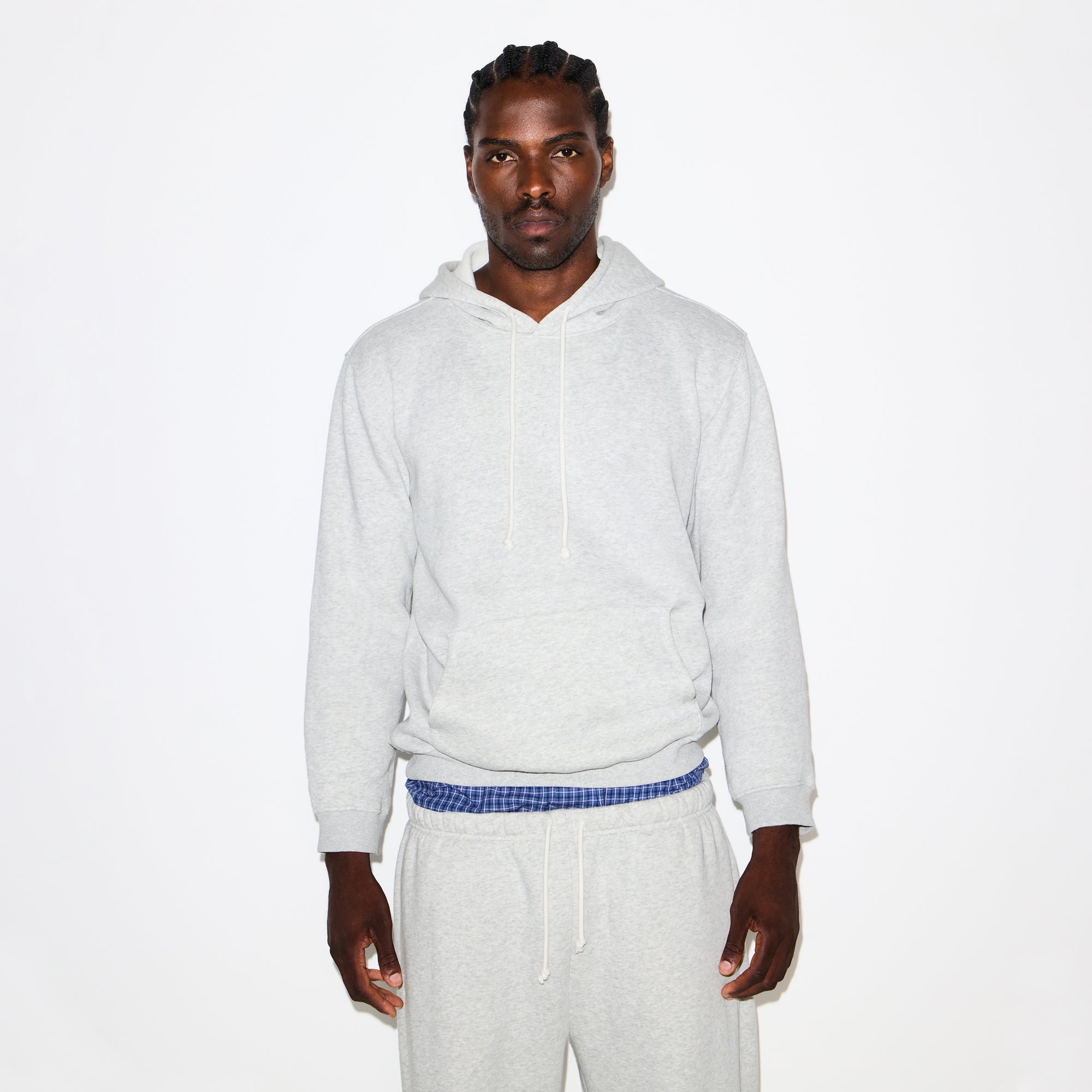 FLEECE LOUNGE MENS CLASSIC HOODIE | LIGHT HEATHER GREY ON A MODEL SIDE VIEW @ | FOCUS: 0.0, 1.0, 0.9