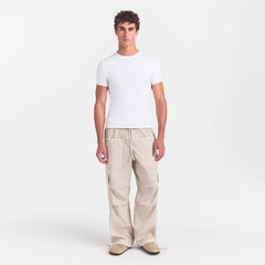 SKIMS COTTON RIB MENS T-SHIRT | CHALK ON A MODEL FRONT VIEW @ | FOCUS: 0.0, 1.0, 0.9