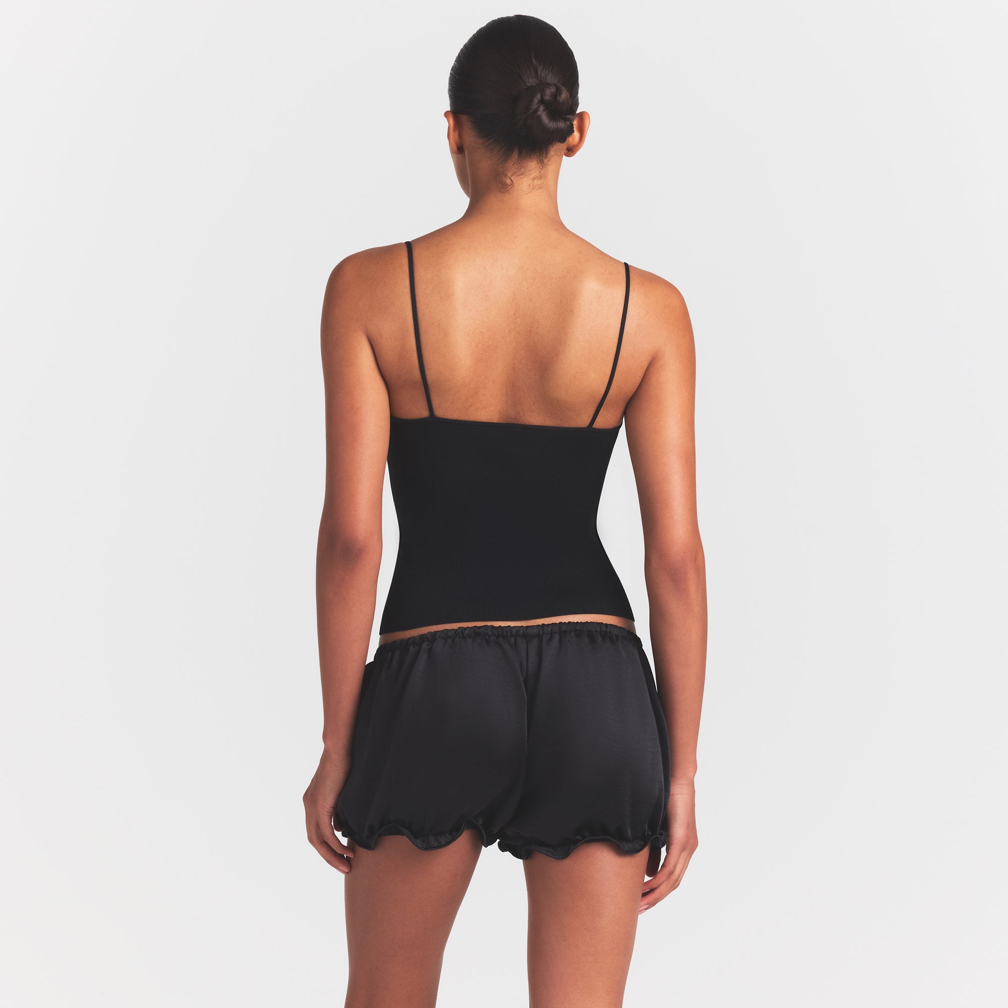 REFINED KNIT CAMI | OBSIDIAN ON A MODEL SIDE VIEW @ | FOCUS: 0.0, 1.0, 0.9
