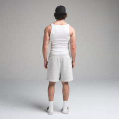 SKIMS COTTON MENS RIB TANK 3-PACK | CHALK ON A MODEL SIDE VIEW | FOCUS: 0.0, 1.0, 0.9