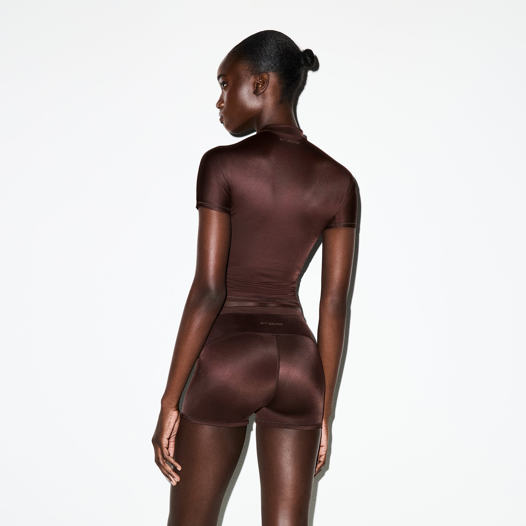 NikeSKIMS SHINE SHORT SLEEVE MOCK NECK TOP | PHOENIX ON A MODEL SIDE VIEW @ | FOCUS: 0.0, 1.0, 0.9