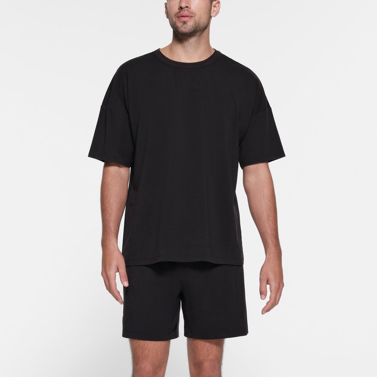 JERSEY LOUNGE MENS RELAXED T-SHIRT | OBSIDIAN ON A MODEL FRONT VIEW