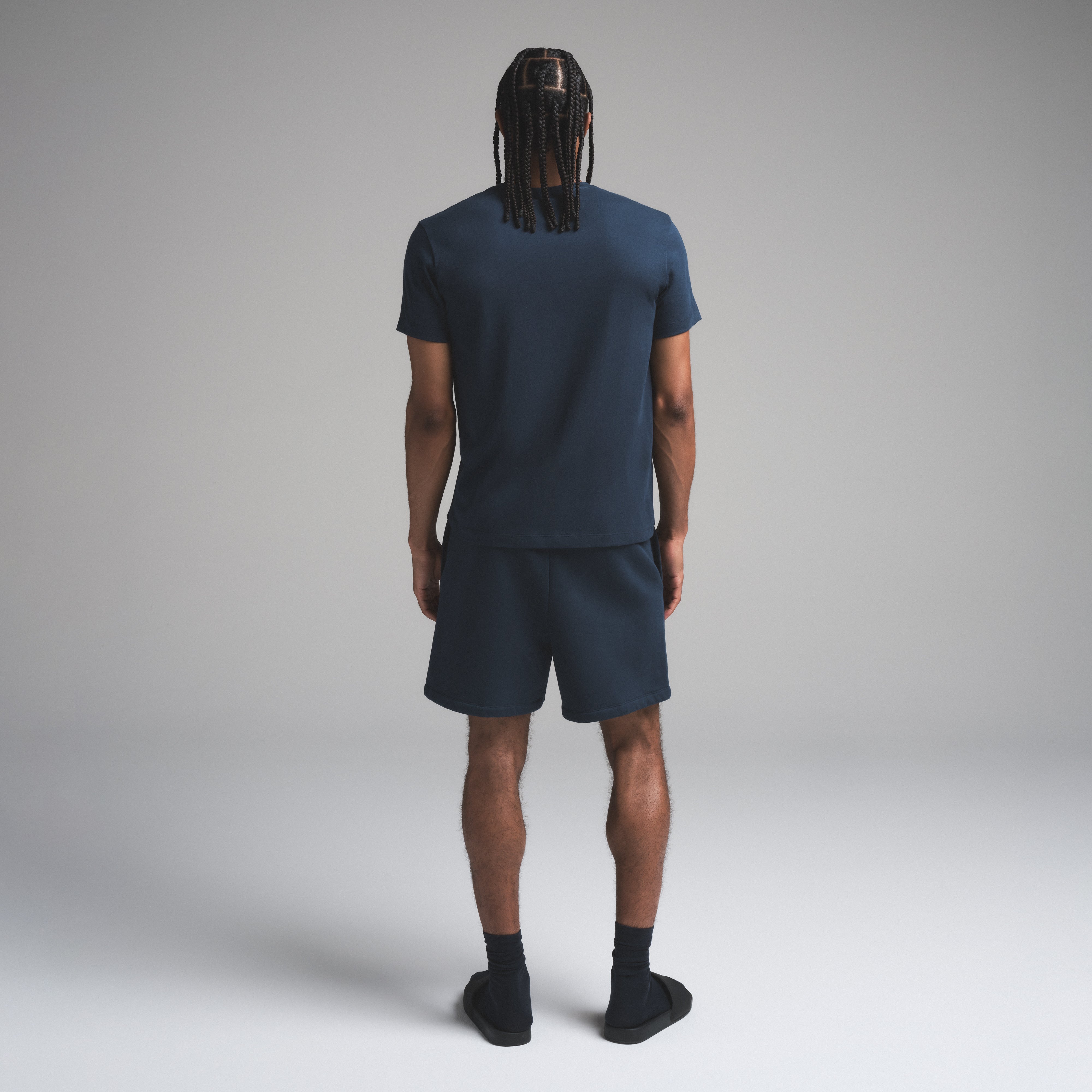 SKIMS COTTON MENS CLASSIC T-SHIRT | NAVY ON A MODEL SIDE VIEW | FOCUS: 0.0, 1.0, 0.9