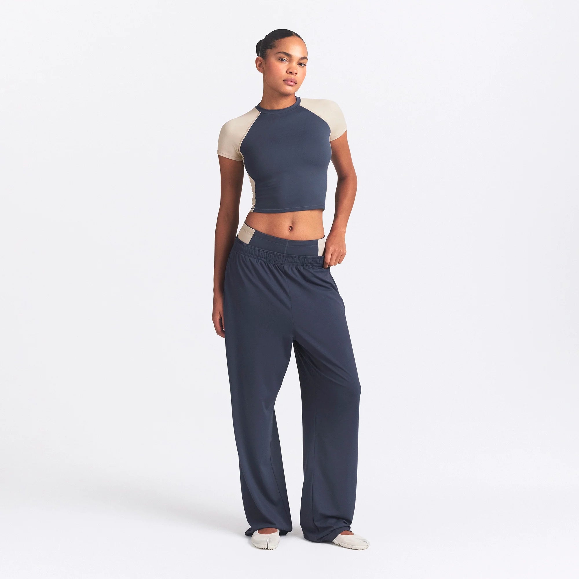 NikeSKIMS MATTE AND SHINE CREWNECK CROP SHORT SLEEVE | DEEP ROYAL/STONE ON A MODEL FRONT VIEW @ | FOCUS: 0.0, 1.0, 0.9