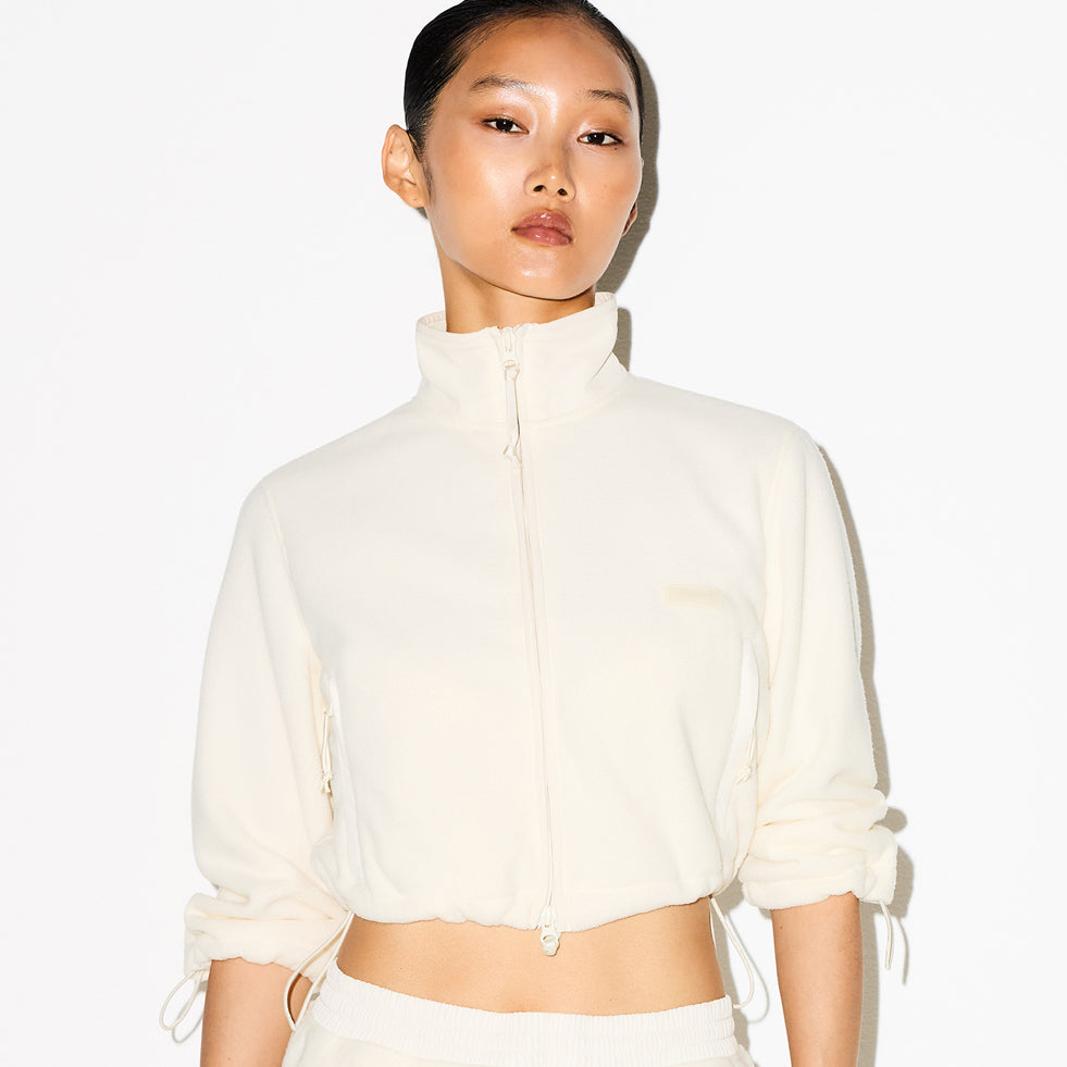 OUTDOOR FLEECE SHRUNKEN ZIP UP JACKET | ECRU ON A MODEL SIDE VIEW @ | FOCUS: 0.0, 1.0, 0.9